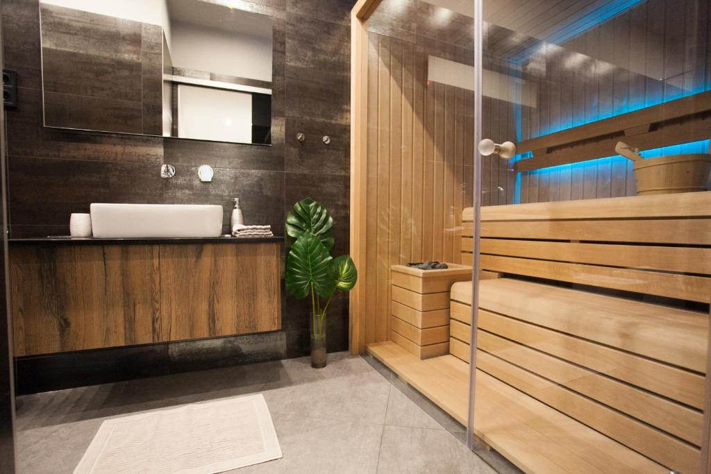 a bathroom with a sink and a mirror at Stylish Loft with Finnish SAUNA in Budapest