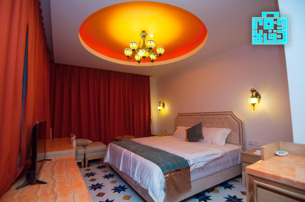 Postel nebo postele na pokoji v ubytování Hotel Hilal