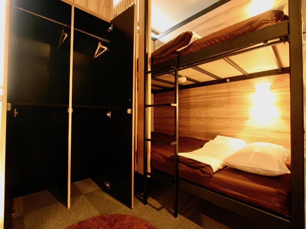 Postel nebo postele na pokoji v ubytování Namba Guesthouse HIVE