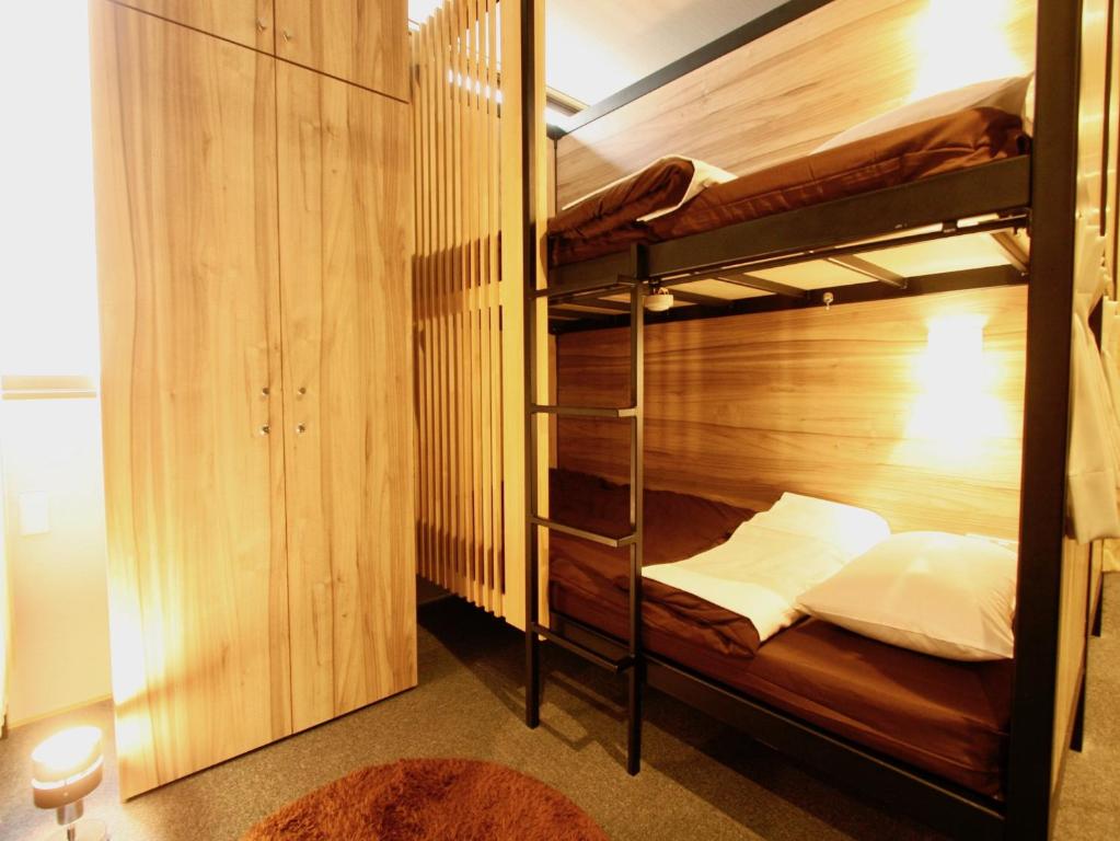 Postel nebo postele na pokoji v ubytování Namba Guesthouse HIVE