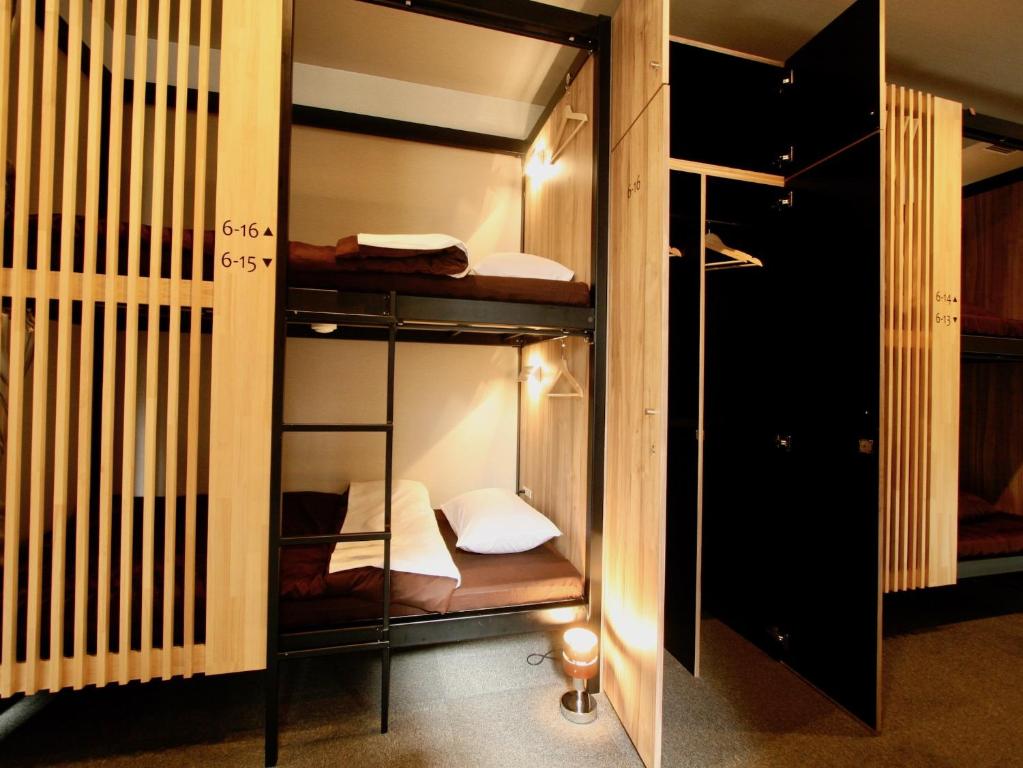 Postel nebo postele na pokoji v ubytování Namba Guesthouse HIVE