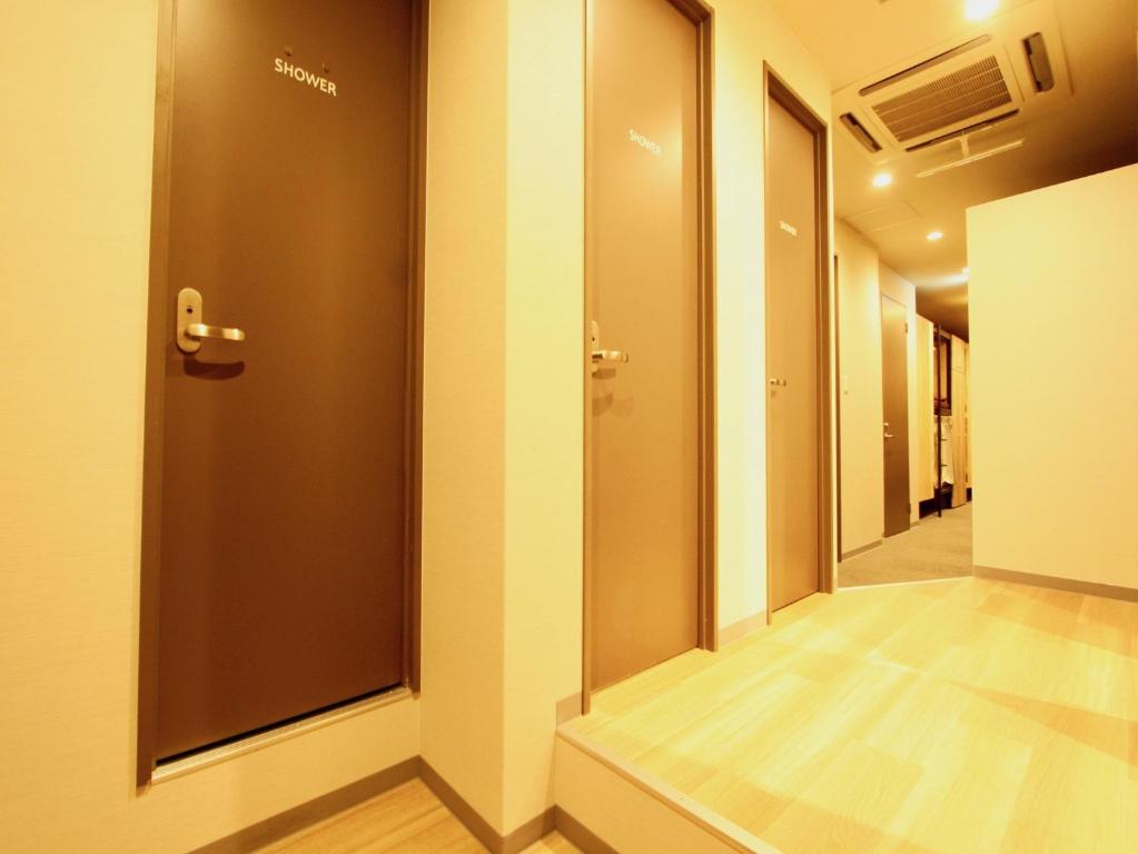 Postel nebo postele na pokoji v ubytování Namba Guesthouse HIVE