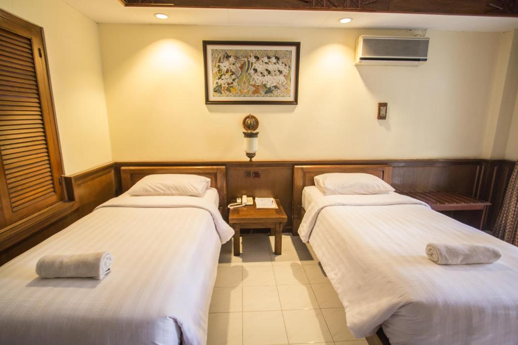 Postel nebo postele na pokoji v ubytování Duta Garden Hotel