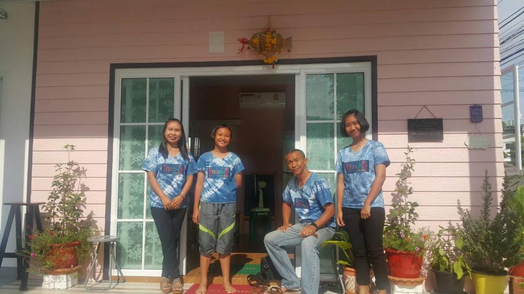a group of women standing in front of a house at Patchy & PPraw Family in Ubon Ratchathani