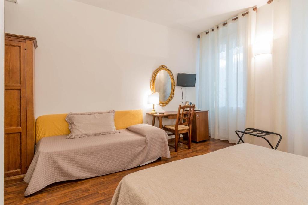 Postel nebo postele na pokoji v ubytování Hotel Rex