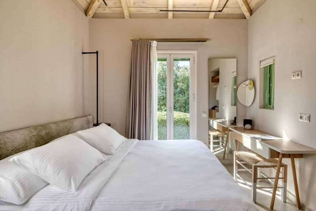 Postel nebo postele na pokoji v ubytování Artblue Villas