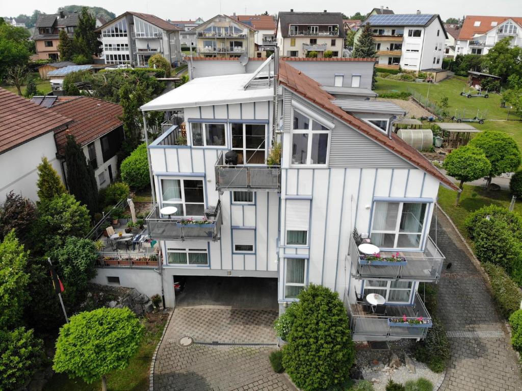 an aerial view of a house in a city at Ferienwohnungen Günther Hund in Immenstaad am Bodensee