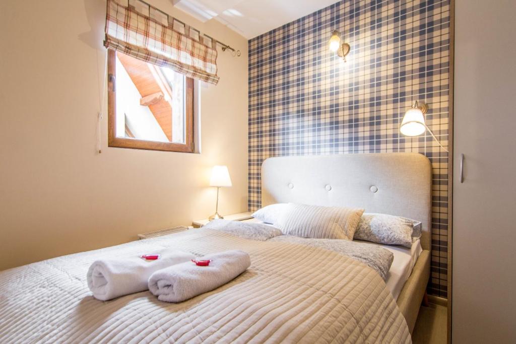 Posteľ alebo postele v izbe v ubytovaní Apartamenty Smrekowa Zakopane