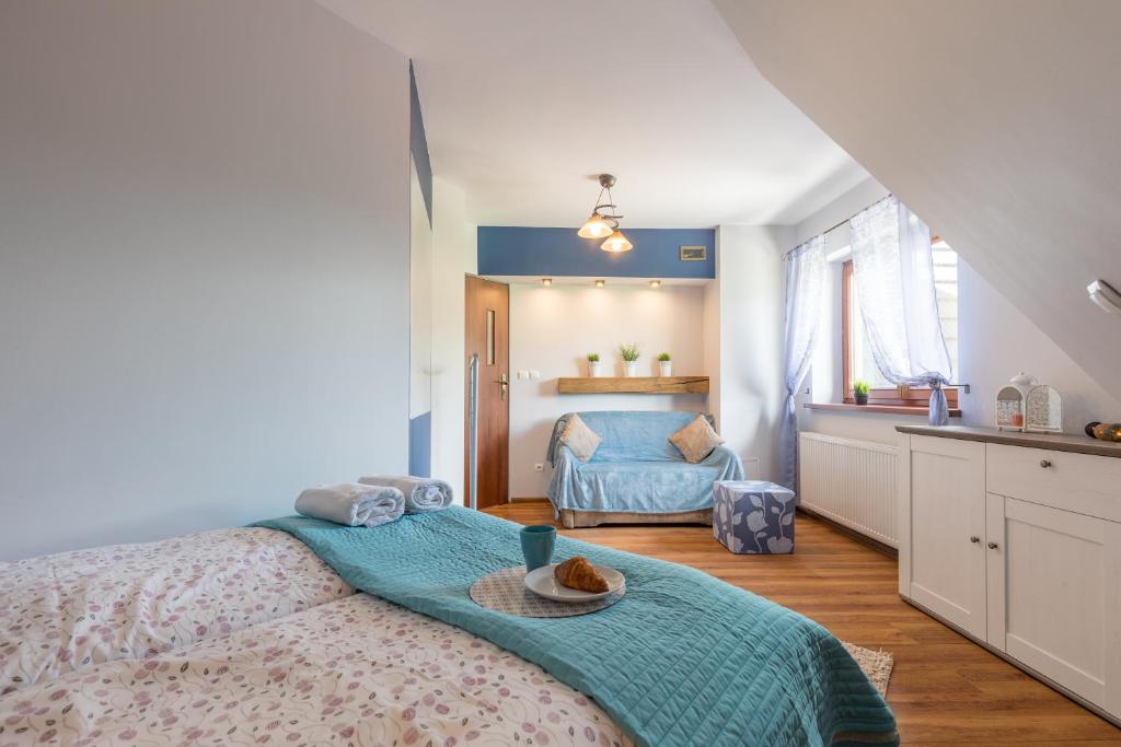 Posteľ alebo postele v izbe v ubytovaní Apartamenty Smrekowa Zakopane