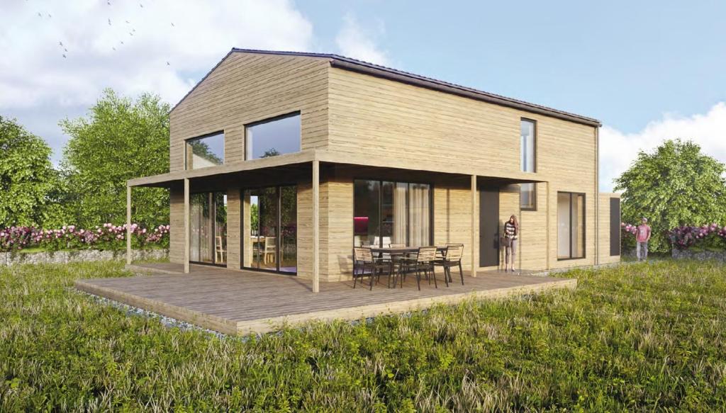 ein Haus mit einer Terrasse in der Mitte eines Feldes in der Unterkunft Gud Jard Chalet Nr 18 - Design-Ferienhaus mit exklusiver Ausstattung in Pellworm