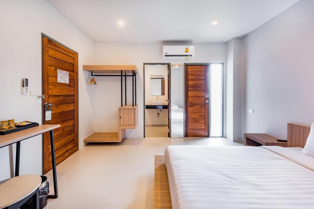 Postel nebo postele na pokoji v ubytování Phuket Marine Poshtel - SHA Plus