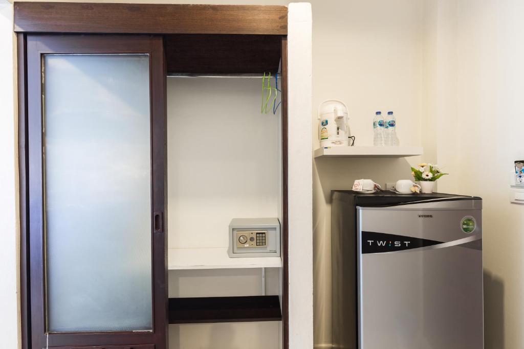 Kuchyň nebo kuchyňský kout v ubytování Kasemsuk Guesthouse SHA Extra plus