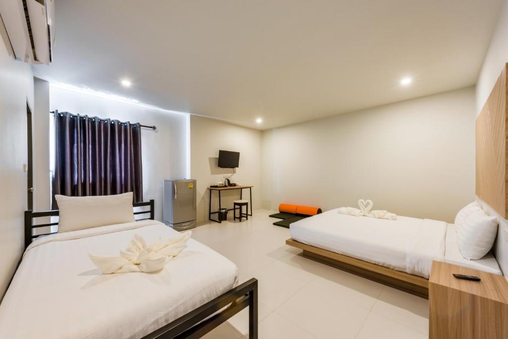 Postel nebo postele na pokoji v ubytování Phuket Marine Poshtel - SHA Plus