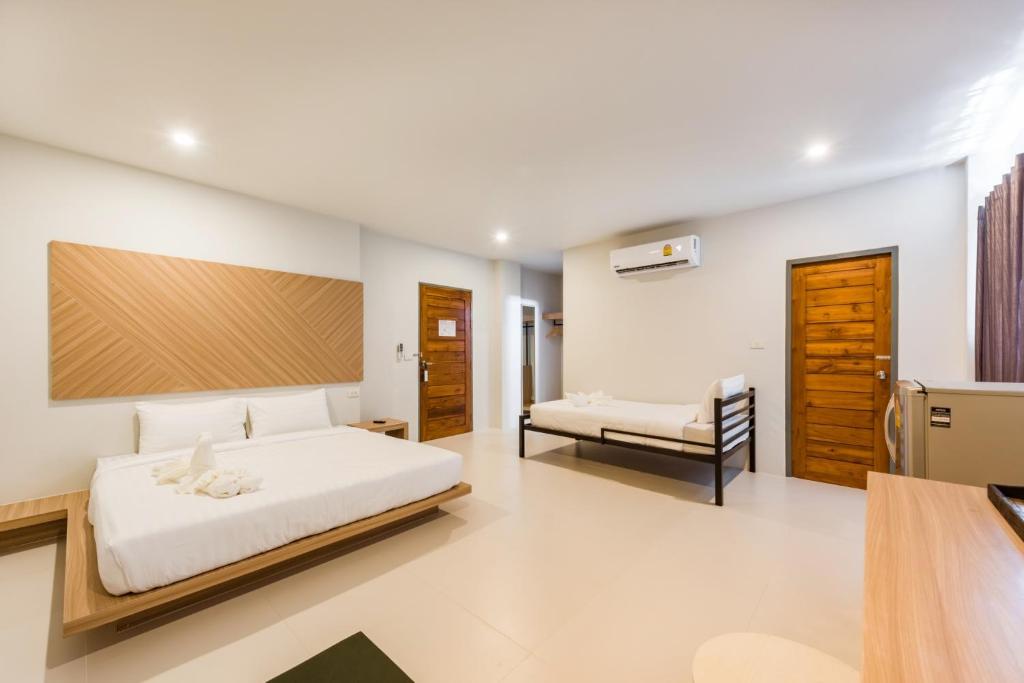 Postel nebo postele na pokoji v ubytování Phuket Marine Poshtel - SHA Plus