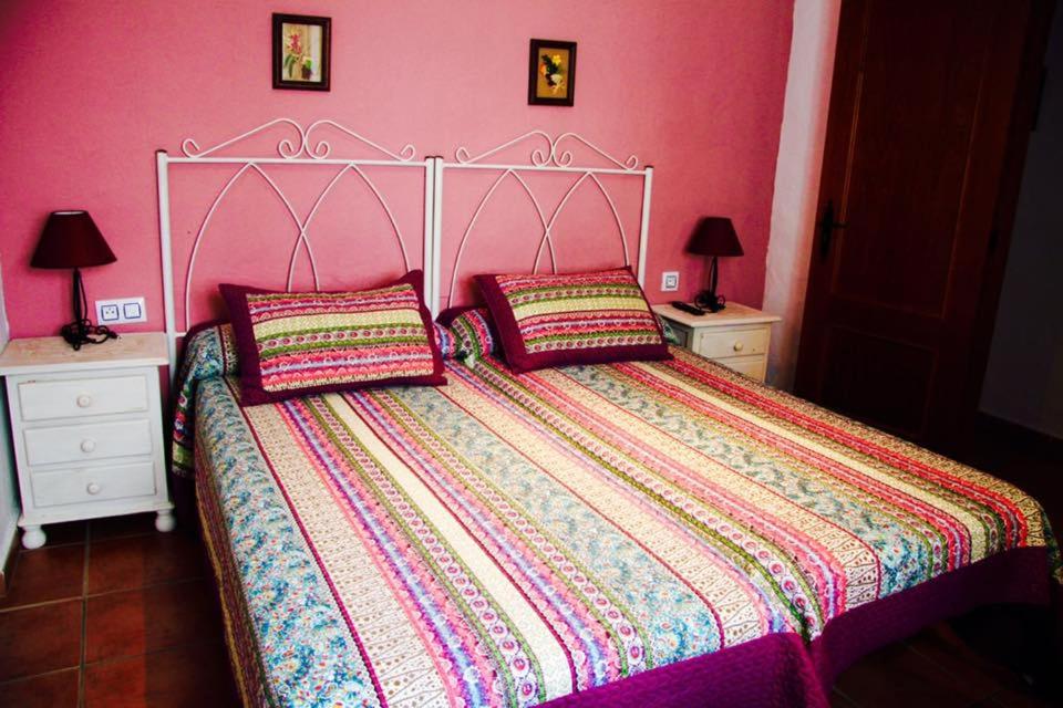 Postel nebo postele na pokoji v ubytování Hostal El Espinel