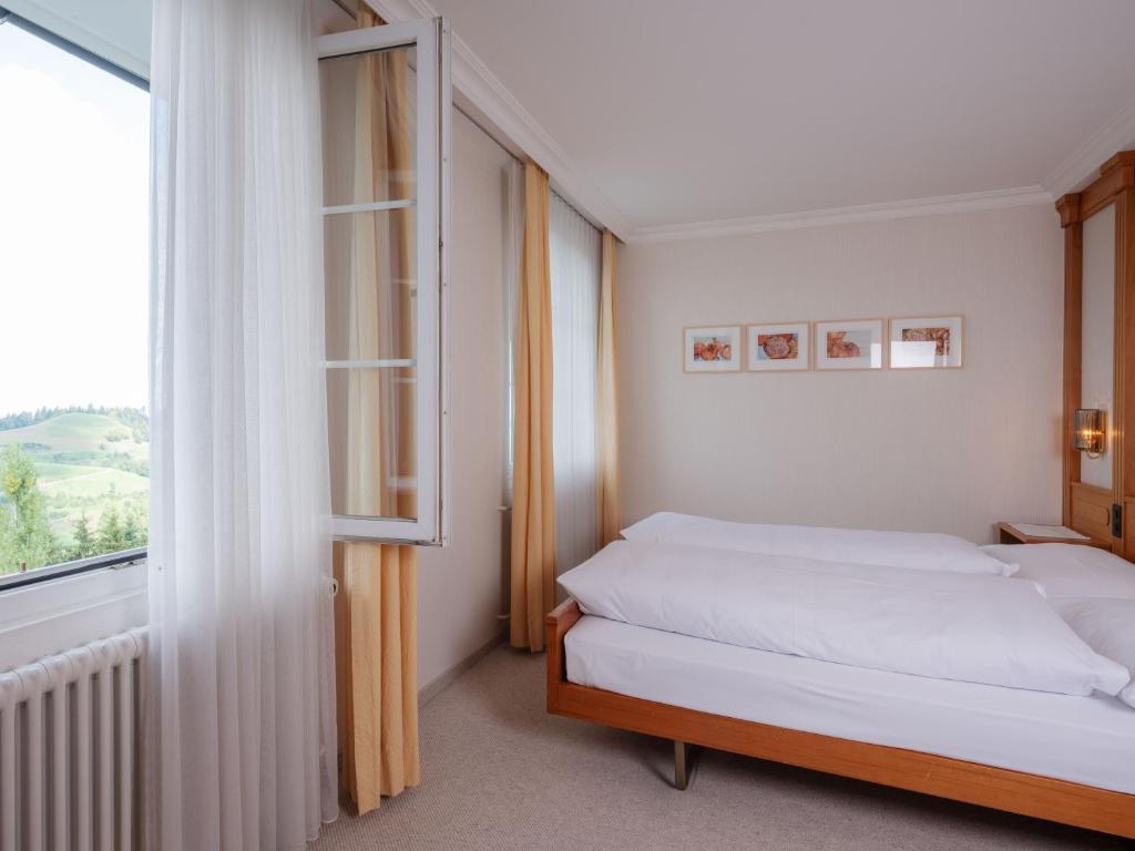 Ένα ή περισσότερα κρεβάτια σε δωμάτιο στο Landgasthof Hotel Menzberg
