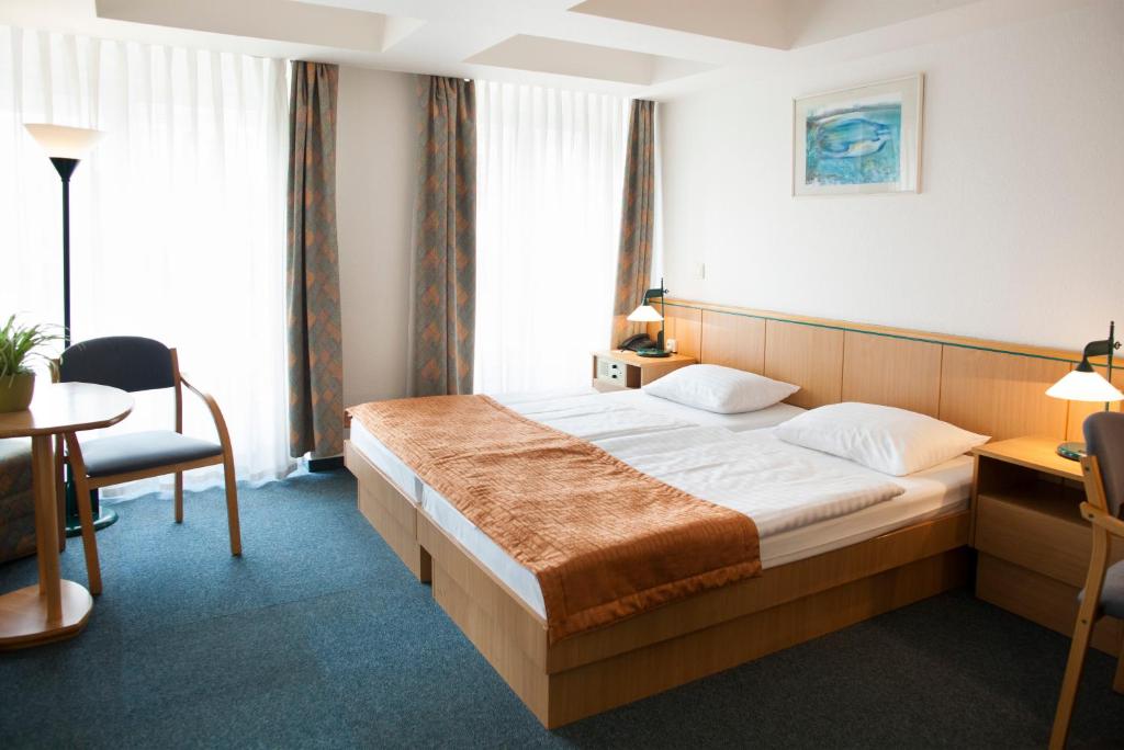 מיטה או מיטות בחדר ב-City Hotel Matyas