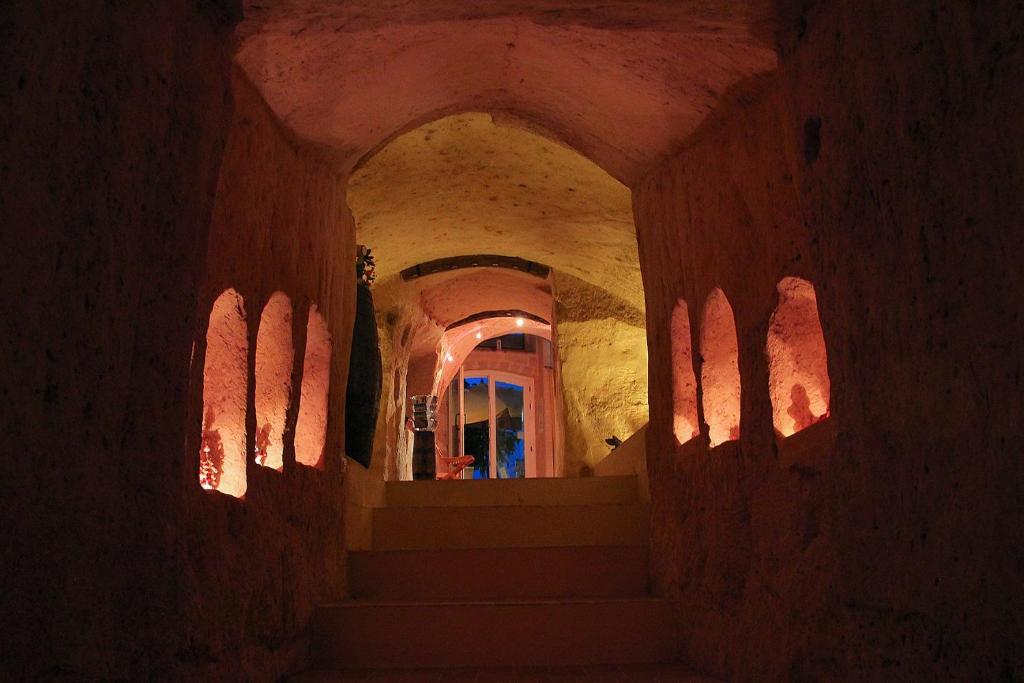 a hallway with stairs and a window in a building at La Corte Dei Pastori in Matera