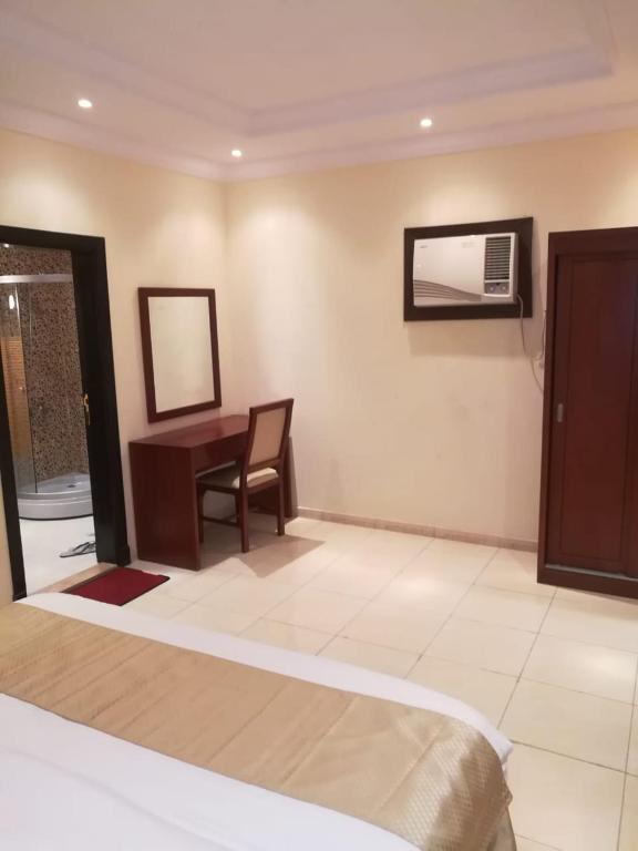 Postel nebo postele na pokoji v ubytování Leen Serviced Apartments