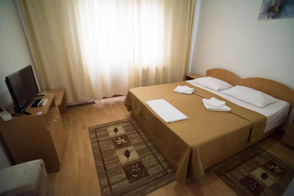Letto o letti in una camera di Pensiunea Melisa