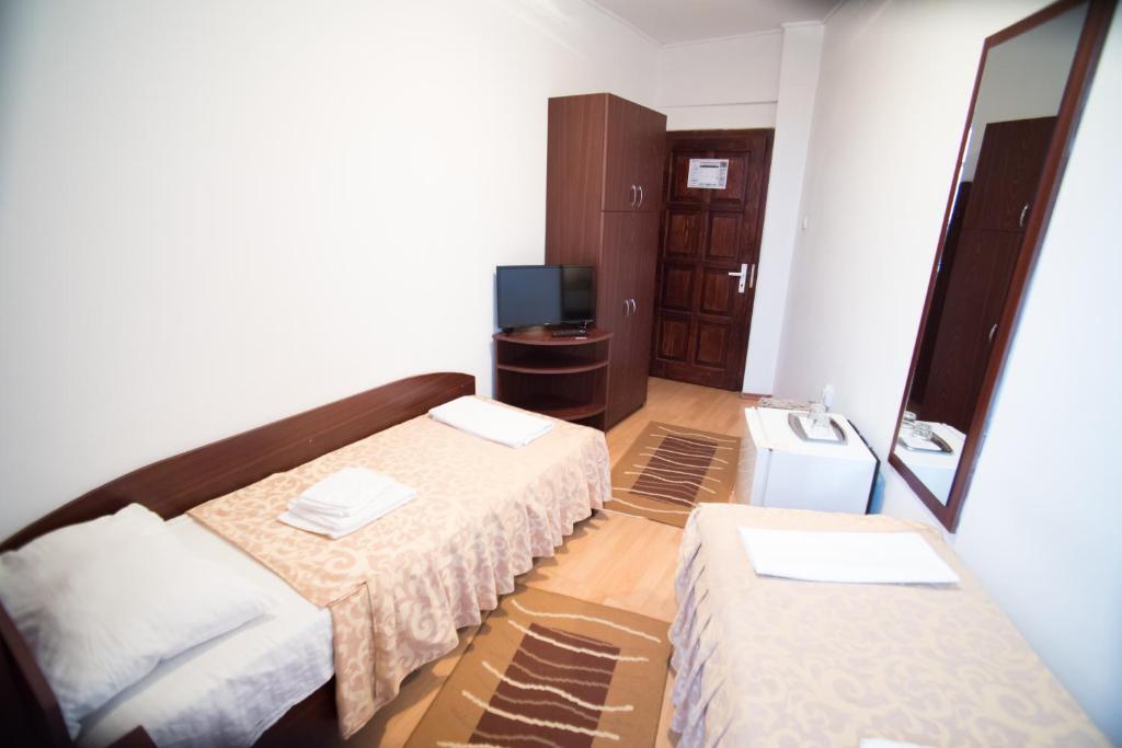 Letto o letti in una camera di Pensiunea Melisa