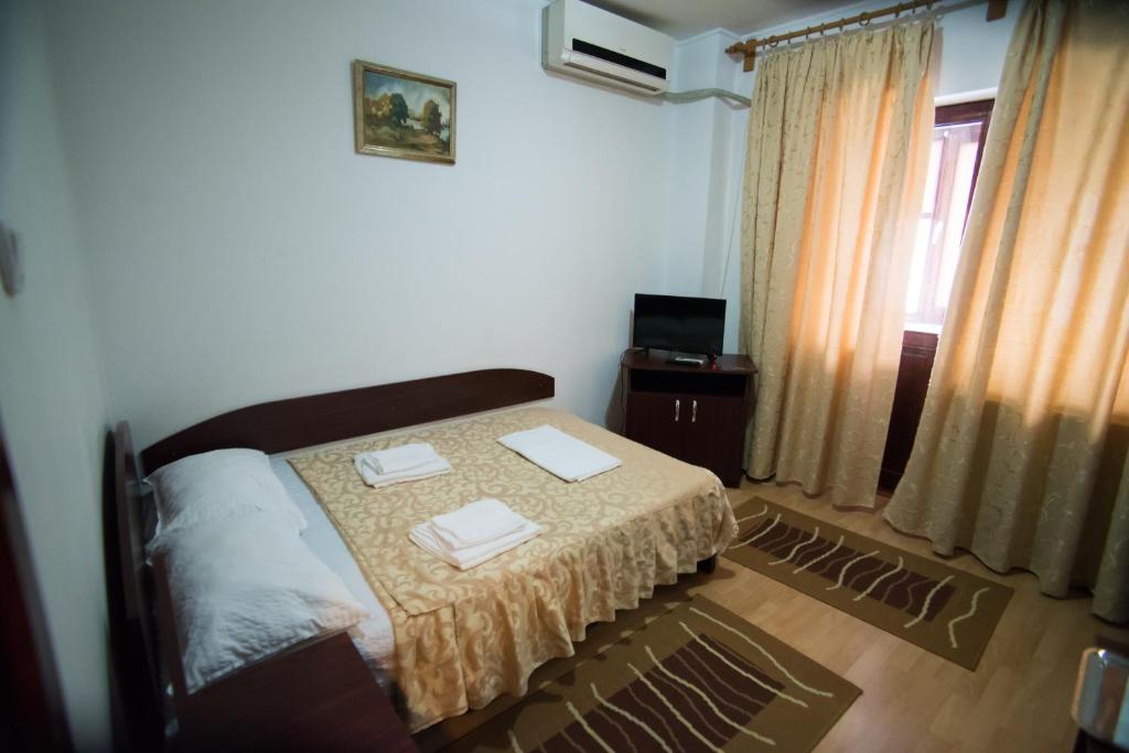 Letto o letti in una camera di Pensiunea Melisa