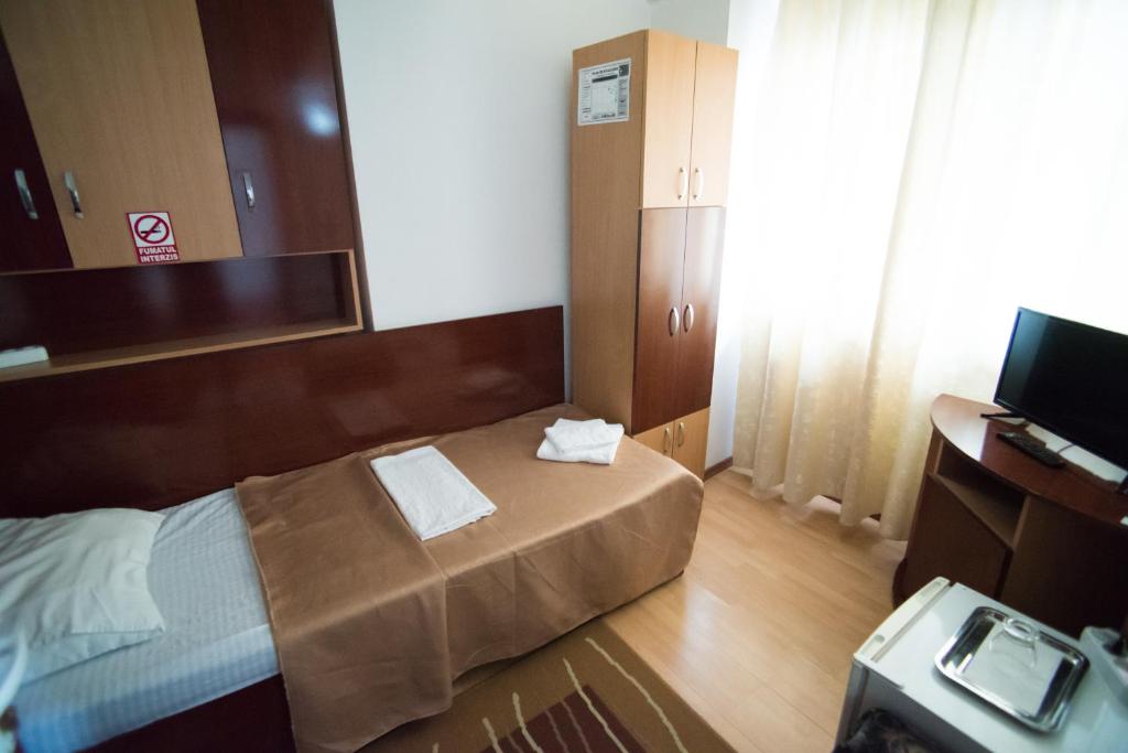 Letto o letti in una camera di Pensiunea Melisa