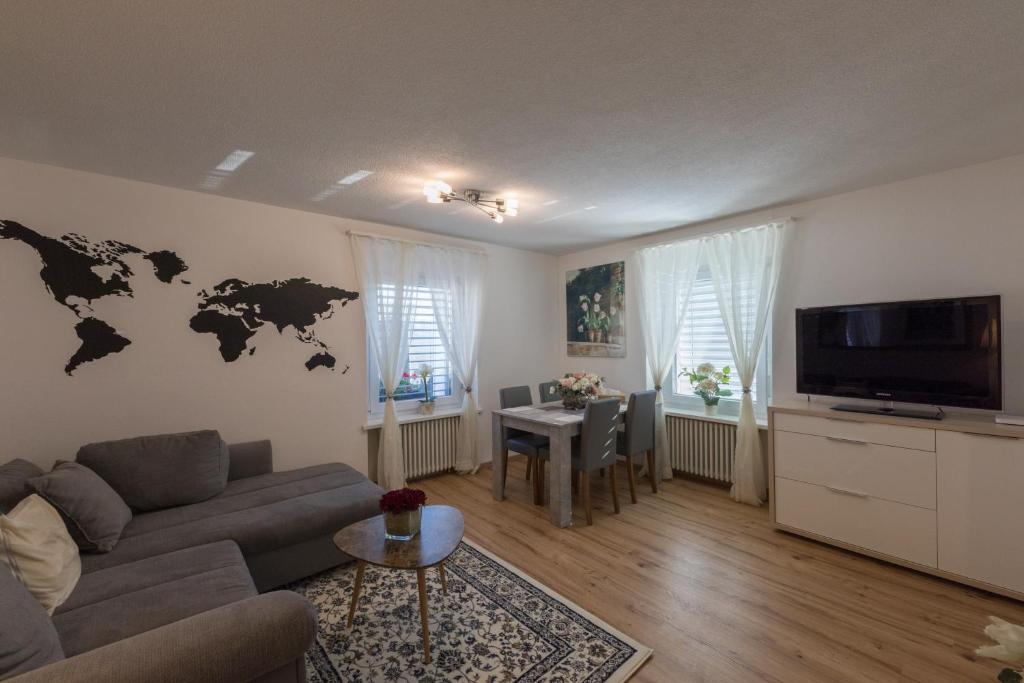 TV a/nebo společenská místnost v ubytování Muhusin Apartments