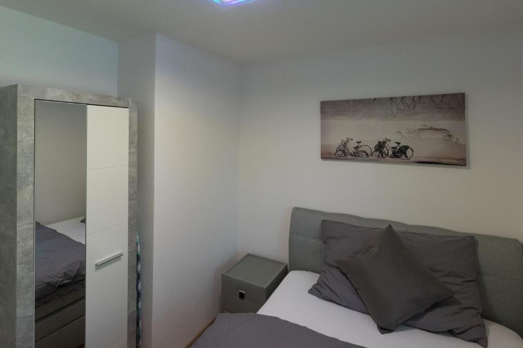 Postel nebo postele na pokoji v ubytování Muhusin Apartments