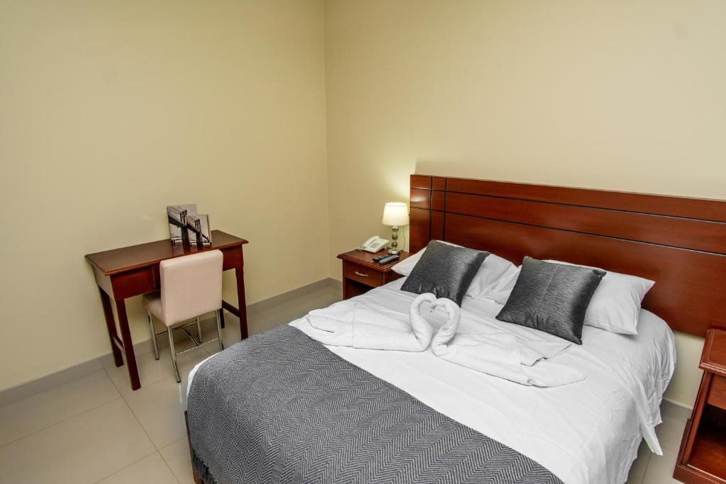 Voodi või voodid majutusasutuse LC Hoteles Piura toas