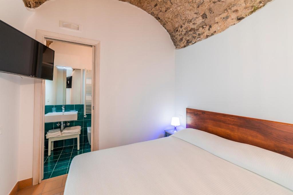 Letto o letti in una camera di Villa Amì