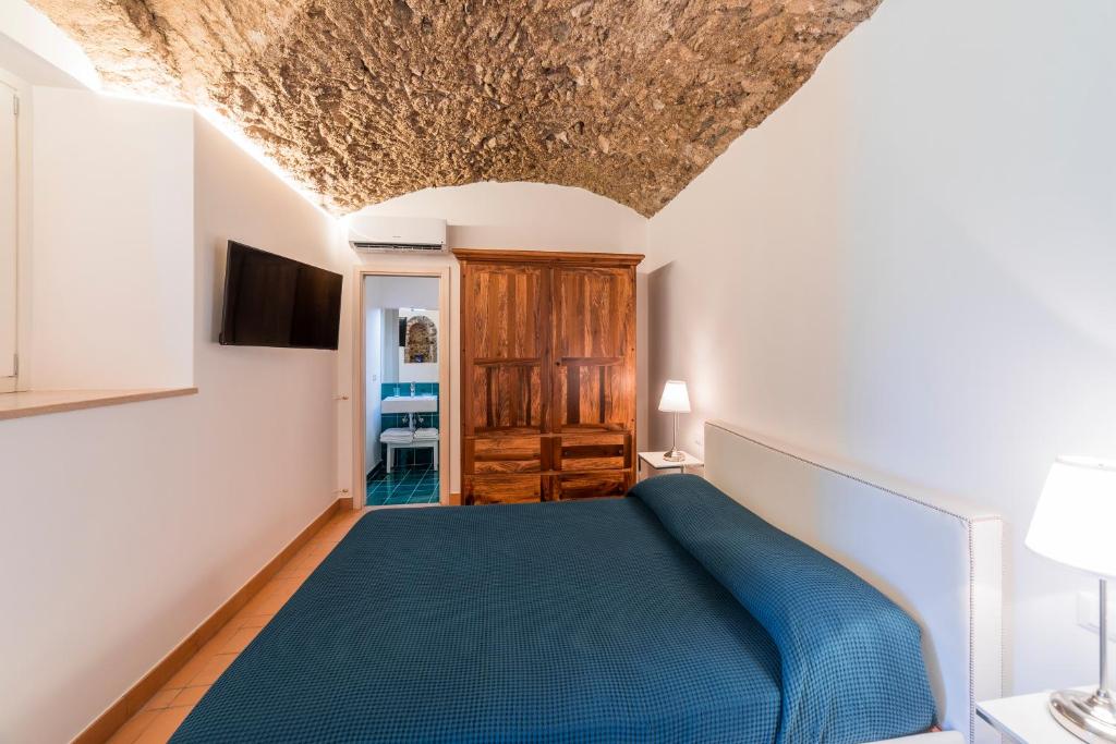 Letto o letti in una camera di Villa Amì