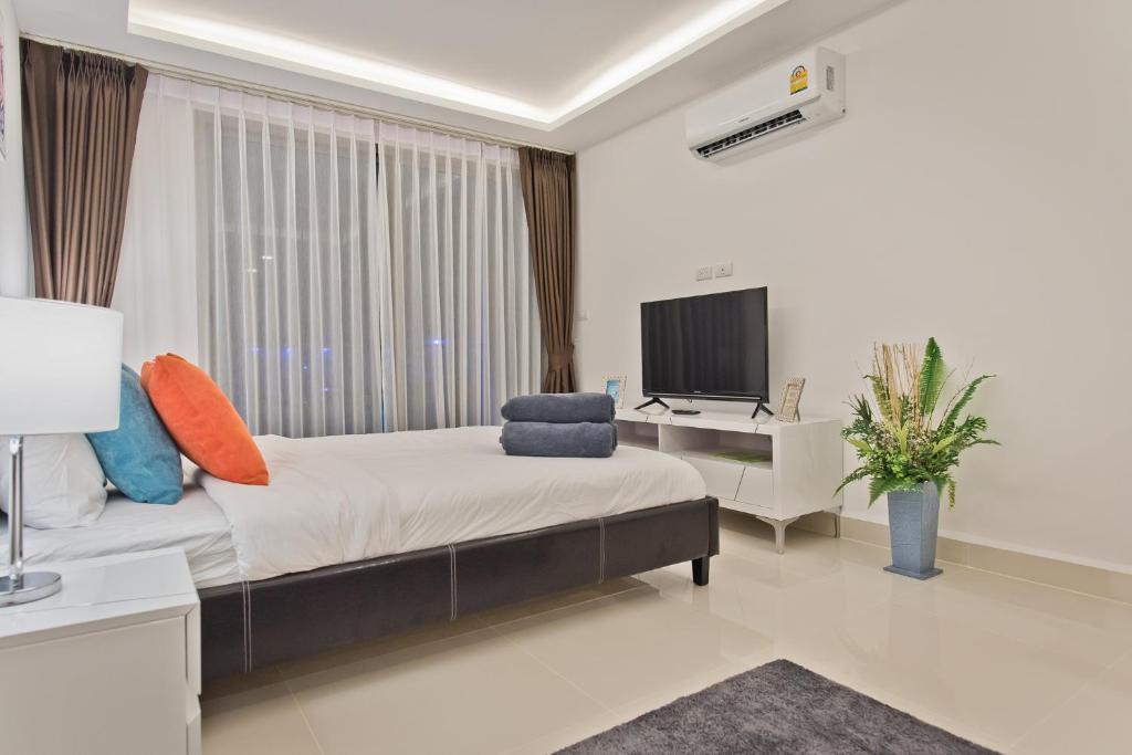 TV a/nebo společenská místnost v ubytování DREAMNEST Studio in Laguna Beach Resort - Maldives