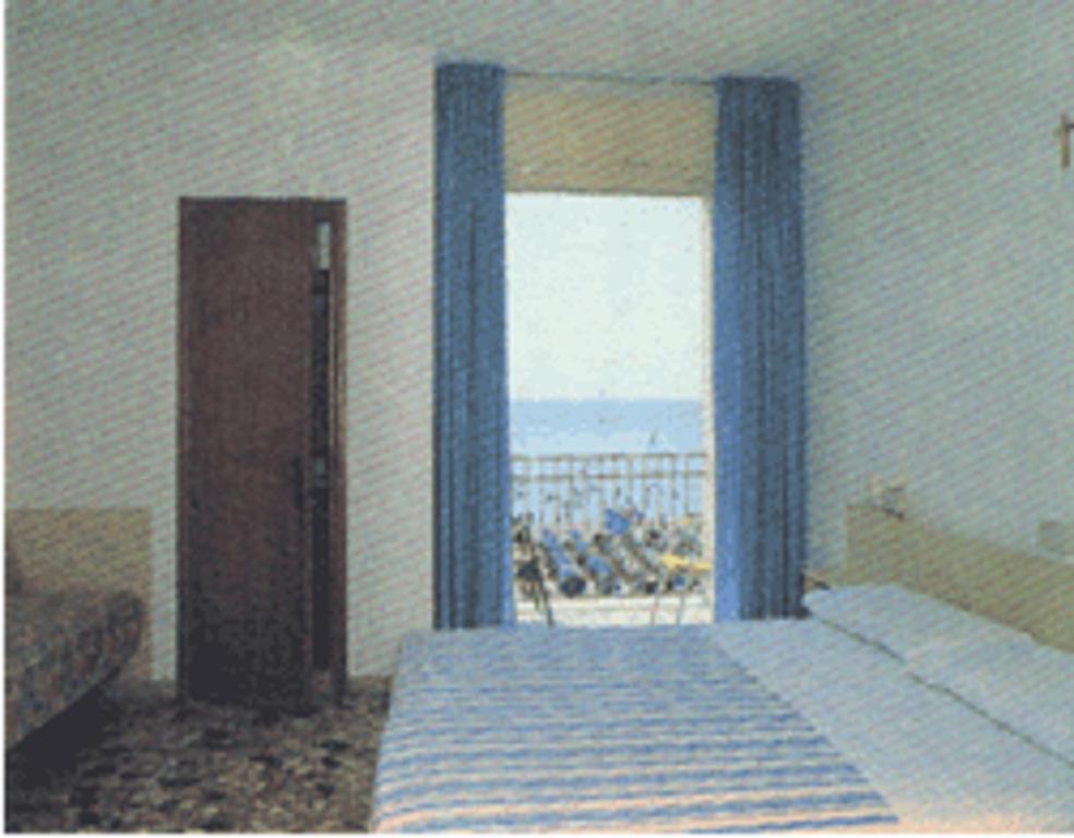 A bed or beds in a room at Hotel Playa e Mare Nostrum