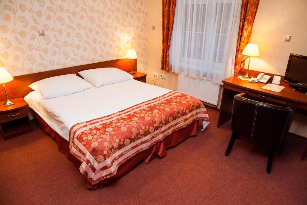 Posteľ alebo postele v izbe v ubytovaní Hotel Logos
