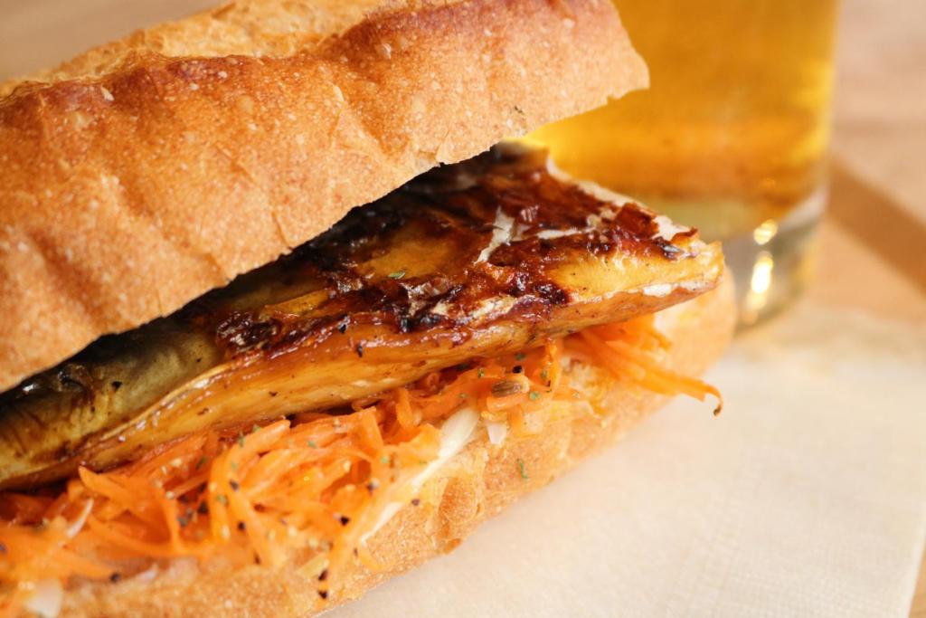 a grilled fish sandwich with cheese and carrots at Guest House MARUYA in Atami