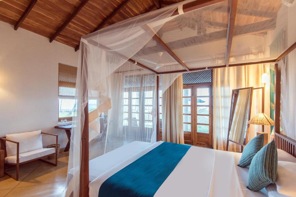 Postel nebo postele na pokoji v ubytování Jetwing Kottukal Beach House