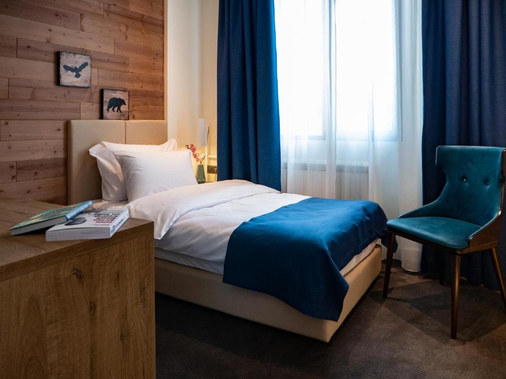 Postel nebo postele na pokoji v ubytování Hotel Putnik Kopaonik