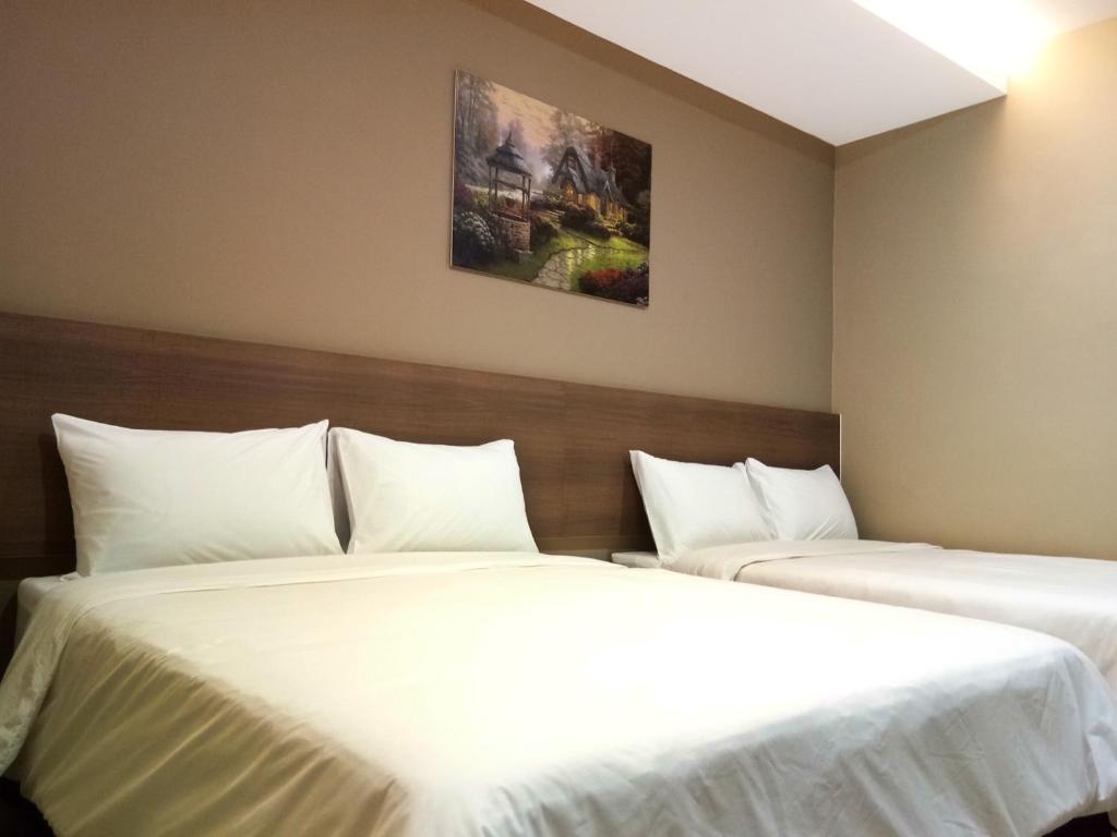 Ένα ή περισσότερα κρεβάτια σε δωμάτιο στο Asiago Hotel
