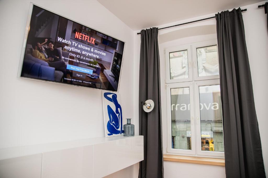 Televízia a/alebo spoločenská miestnosť v ubytovaní W1 Katowice