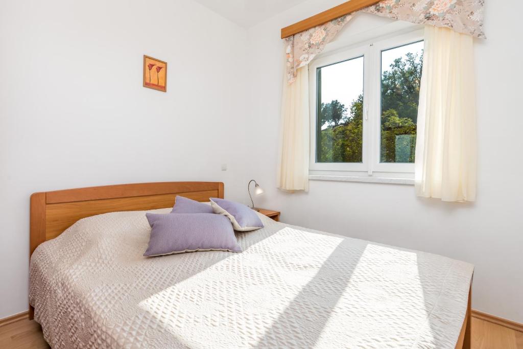 Postel nebo postele na pokoji v ubytování Villas Kampor