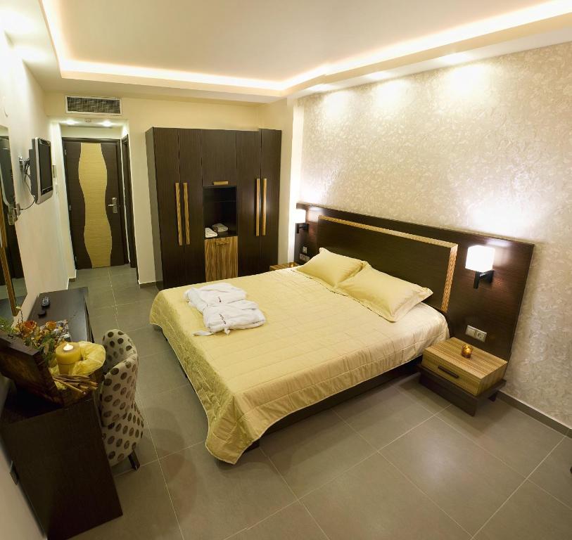 Postel nebo postele na pokoji v ubytování Dion Hotel