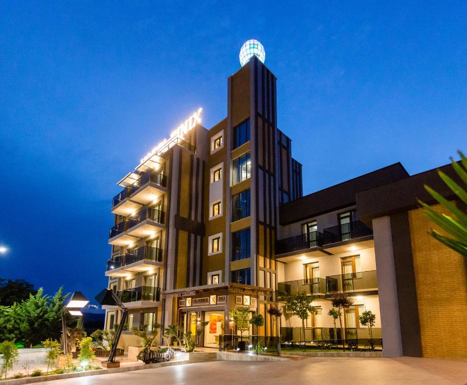 a tall building with a tower on top of it at HOTEL FINIX CASINO in Kulata