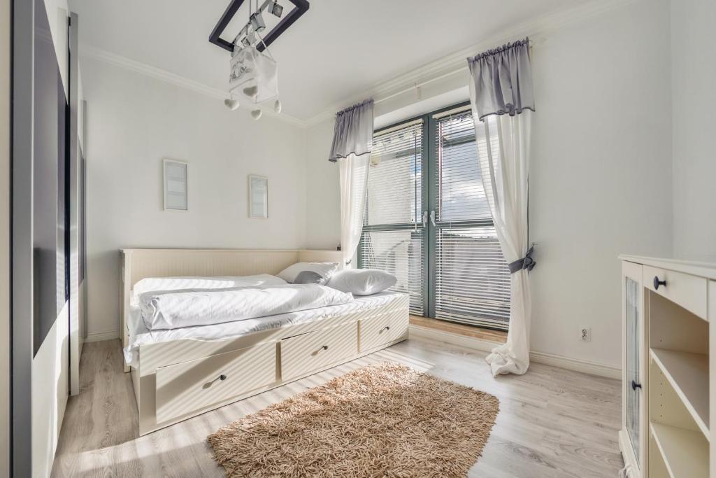 Postel nebo postele na pokoji v ubytování Apartamenty Sun & Snow Międzyzdrojski Rynek