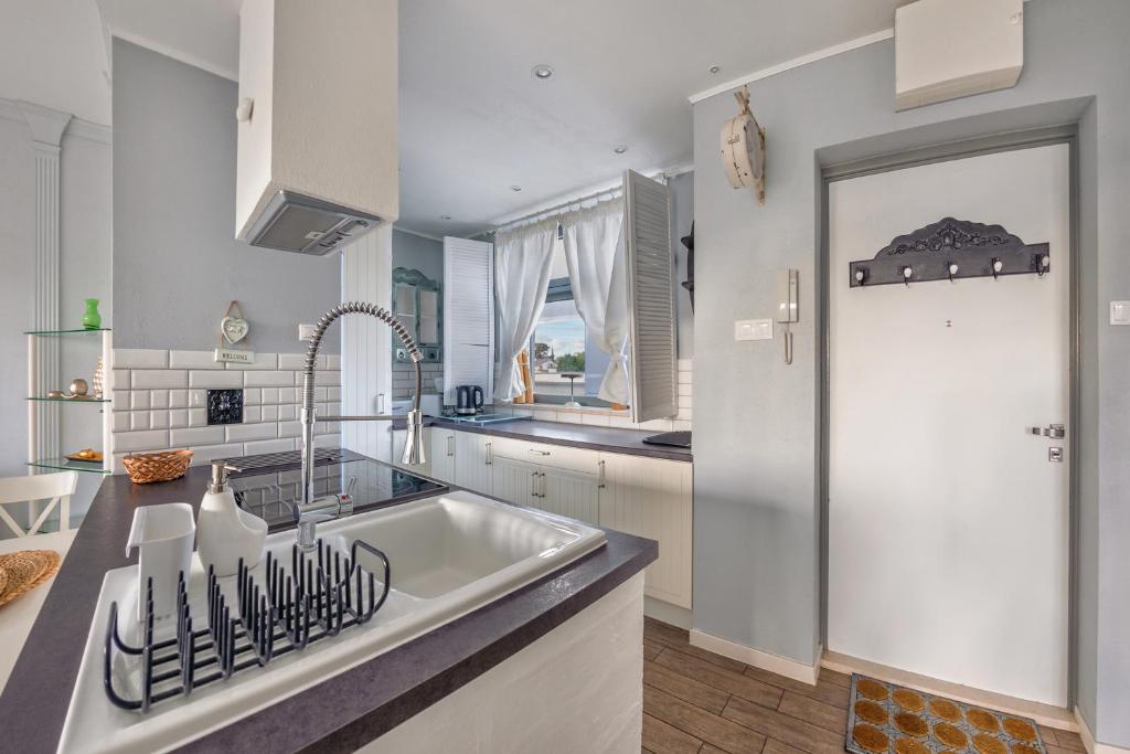 Kuchyň nebo kuchyňský kout v ubytování Apartamenty Sun & Snow Międzyzdrojski Rynek