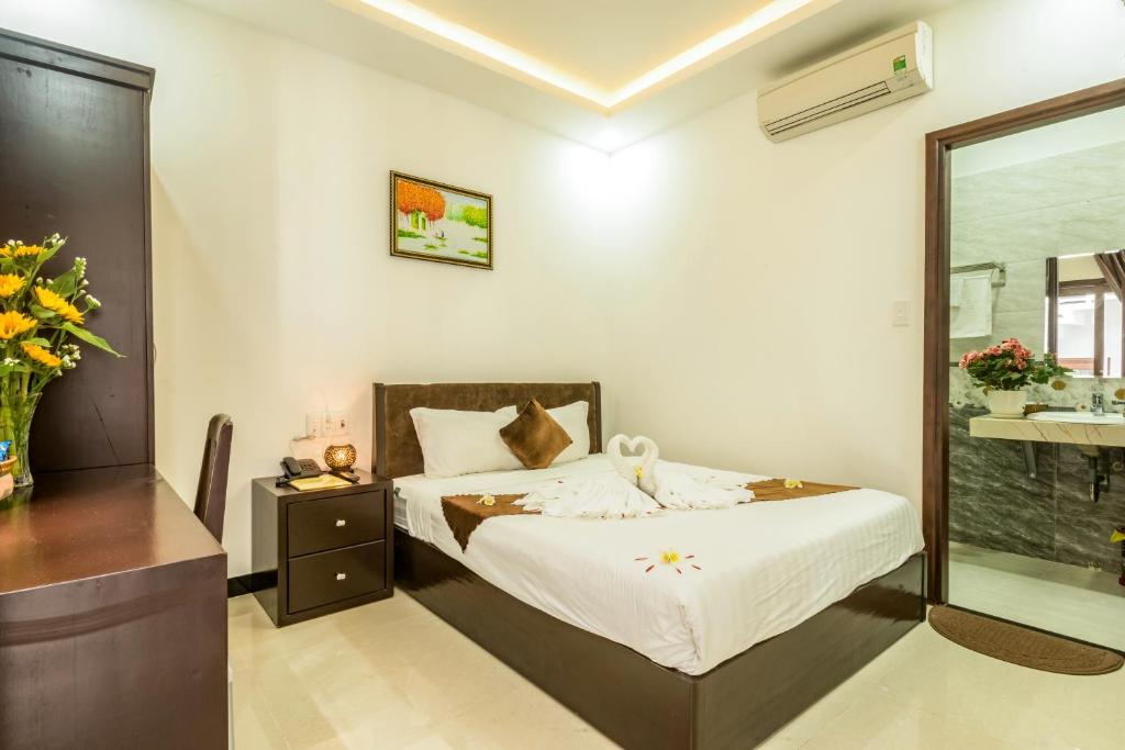 Postel nebo postele na pokoji v ubytování Miss Ten Homestay