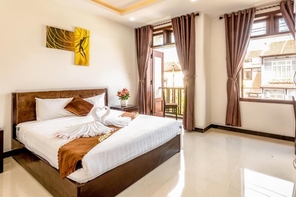 Postel nebo postele na pokoji v ubytování Miss Ten Homestay