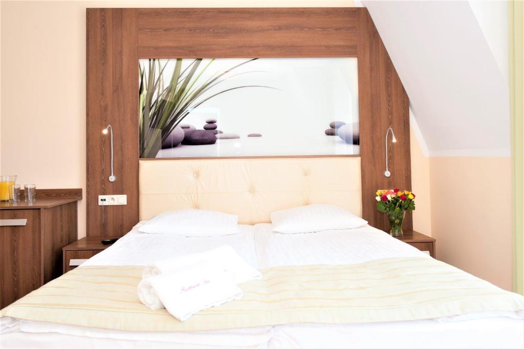 Postel nebo postele na pokoji v ubytování Puchacz - Spa