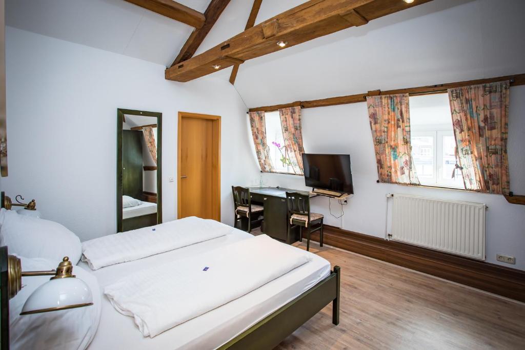 Postel nebo postele na pokoji v ubytování Hotel Ratskeller