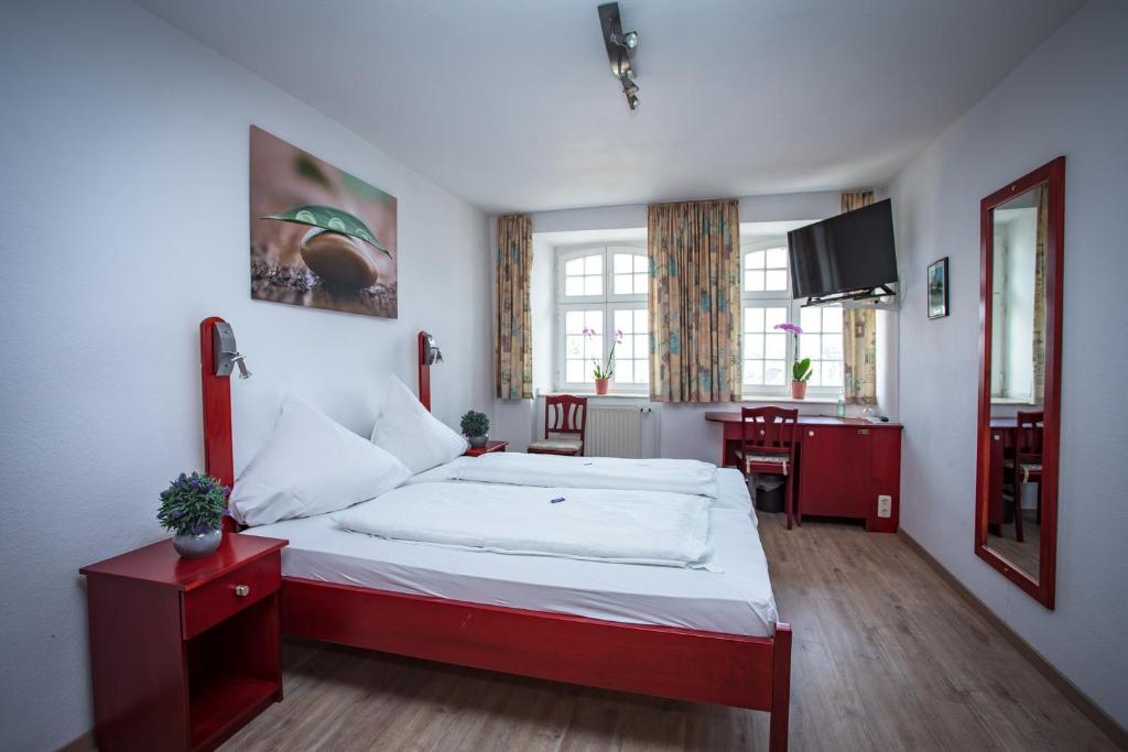 Postel nebo postele na pokoji v ubytování Hotel Ratskeller